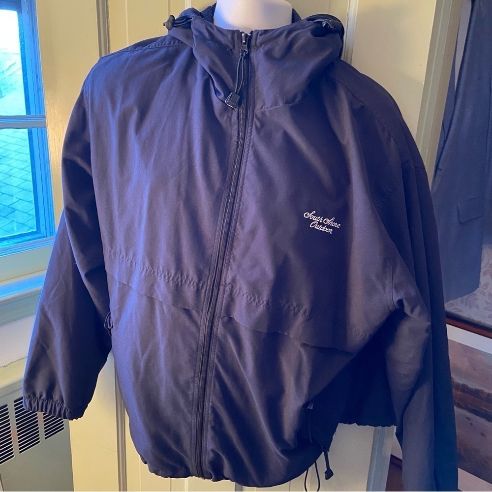 Ultra Club rain jacket with hood. Mesh lined and has pulls to keep out the wind.